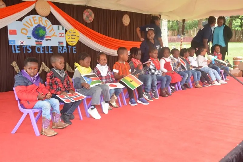 Children holding national flags at the cultural event
